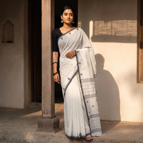 White Phulia Jamdani Pure Handloom Cotton Saree with Tassels (Count 92/40), draped and worn by a woman, AI visual of the saree, iTokri