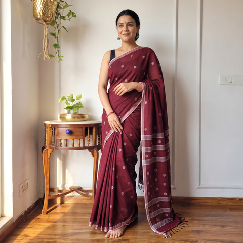 Maroon Phulia Jamdani Pure Handloom Cotton Saree with Tassels (Count 92/60), draped and worn by a woman, AI visual of the saree, iTokri