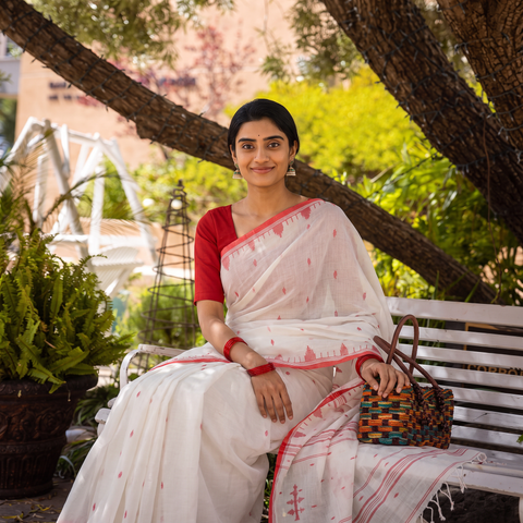 White Phulia Jamdani Pure Handloom Cotton Saree with Tassels (Count 92/60), draped and worn by a woman, AI visual of the saree, iTokri