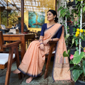 Peach Phulia Jamdani Pure Handloom Cotton Saree with Tassels (Count 92/84), draped and worn by a woman, AI visual of the saree, iTokri