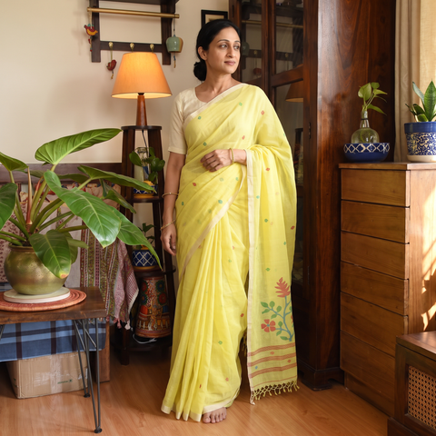 Yellow Phulia Jamdani Pure Handloom Cotton Saree with Tassels (Count 92/84), draped and worn by a woman, AI visual of the saree, iTokri