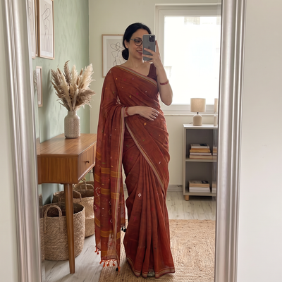 Brown Phulia Jamdani Pure Handloom Cotton Saree with Tassels (Count 92/84), draped and worn by a woman, AI visual of the saree, iTokri