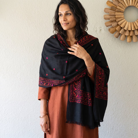 Black Phulkari Hand Embroidered Wool Shawl, worn by a model, AI visual of the shawl, iTokri
