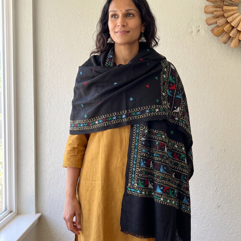 Black Phulkari Hand Embroidered Wool Shawl, worn by a model, AI visual of the shawl, iTokri