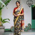 Full front view of the black pen Kalamkari saree with its red village pallu, AI visual of the saree, iTokri