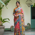 Standing front view of the coral pink pen Kalamkari saree with sunflowers and a mustard pallu, AI visual of the saree, iTokri
