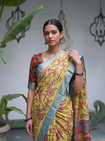 Close front view of the yellow Kalamkari saree with red vines and sky blue border, AI visual of the saree, iTokri