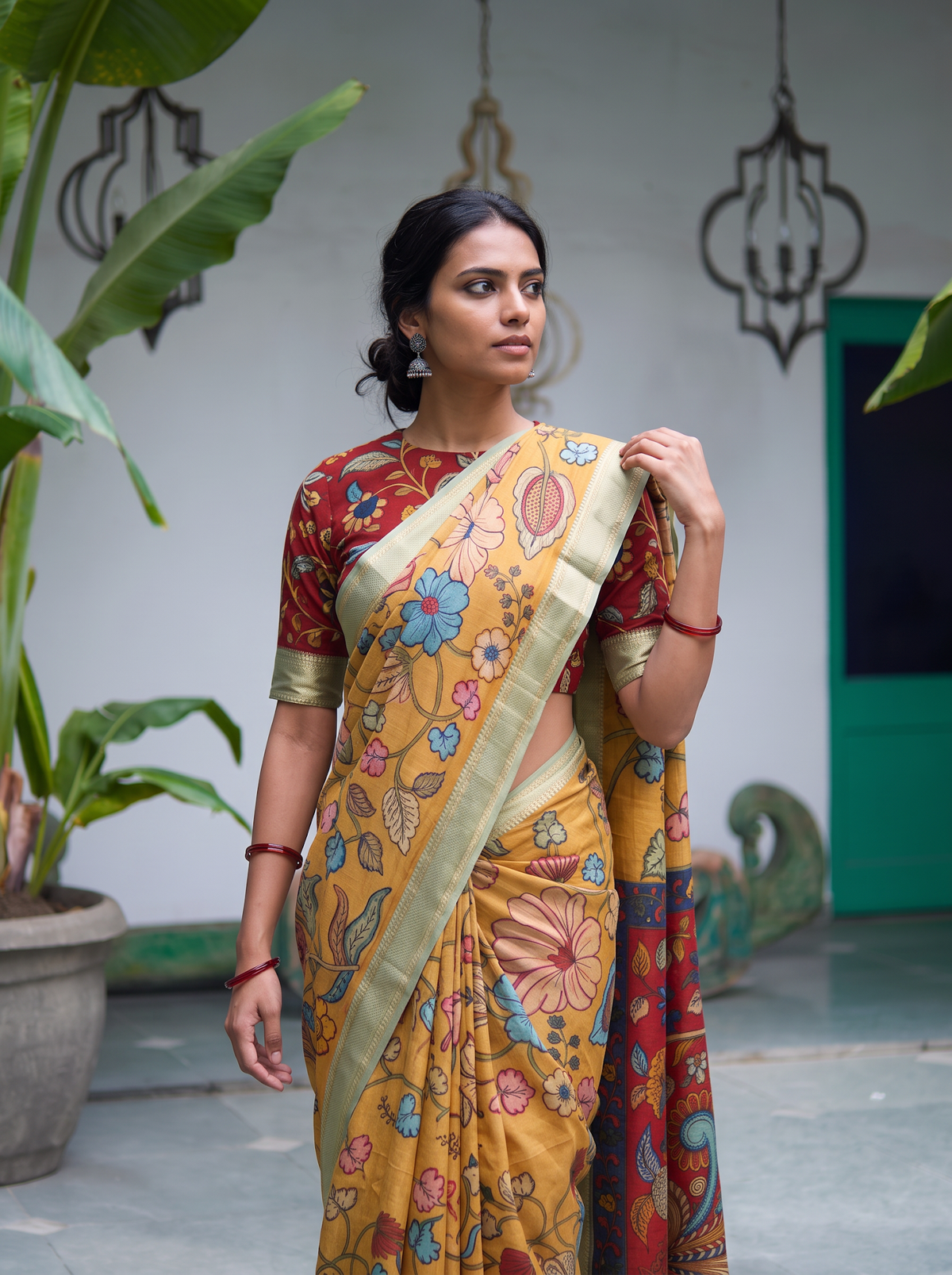 Close front view of the mustard Kalamkari saree, large painted flowers, gold border, AI visual of the saree, iTokri