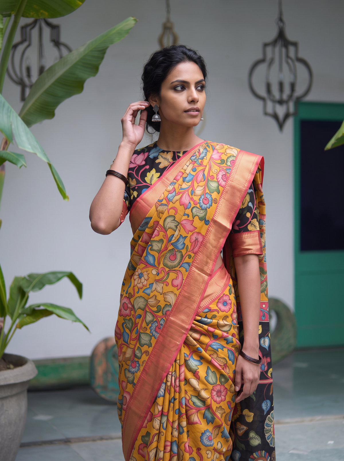 Close front view of the mustard Kalamkari saree with flower vines and coral border, AI visual of the saree, iTokri