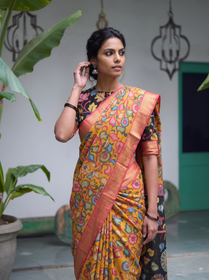Close front view of the mustard Kalamkari saree with flower vines and coral border, AI visual of the saree, iTokri