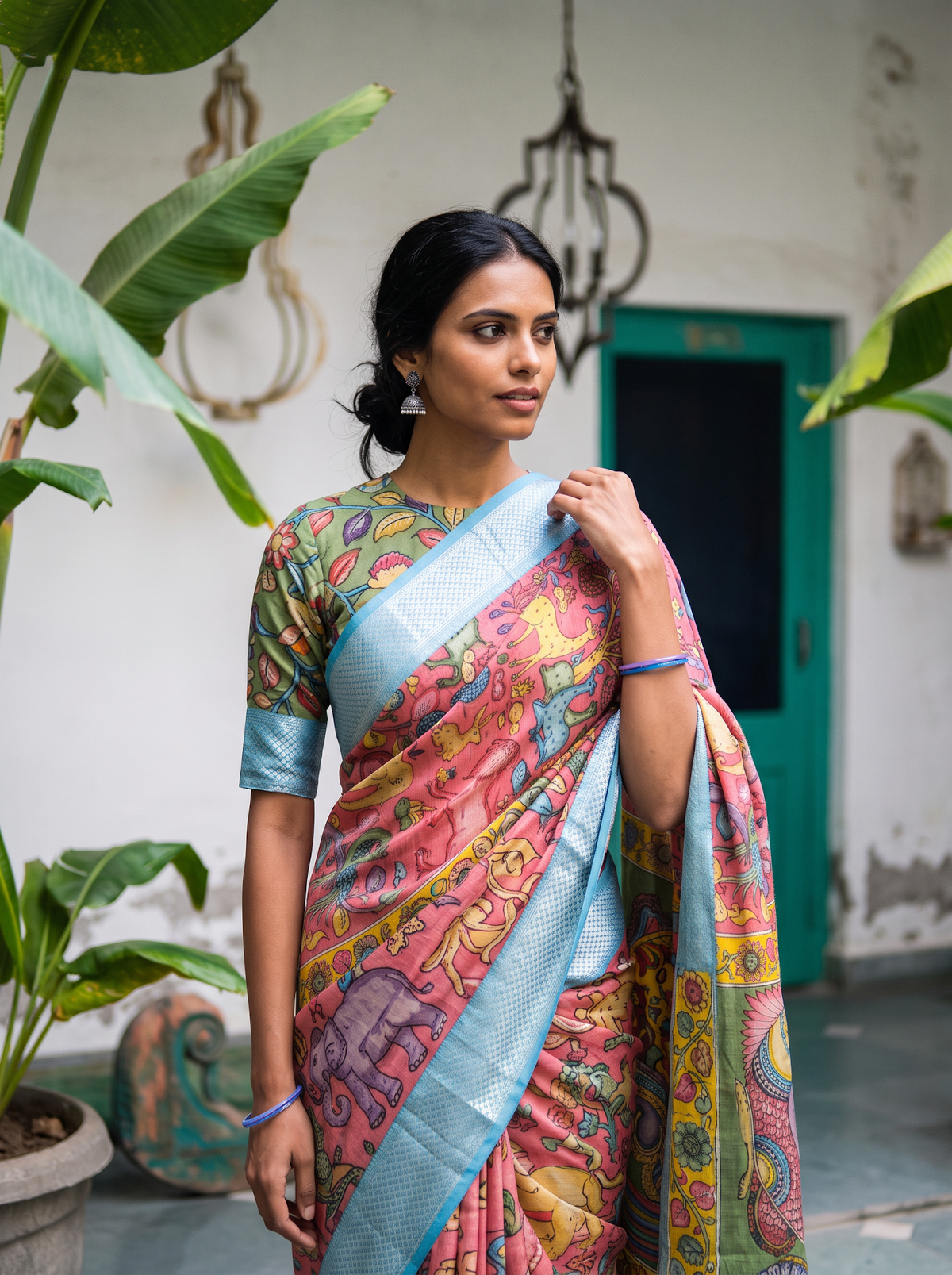 Deer and elephants on pink beside the silvery blue border, seen close from the front, AI visual of the saree, iTokri