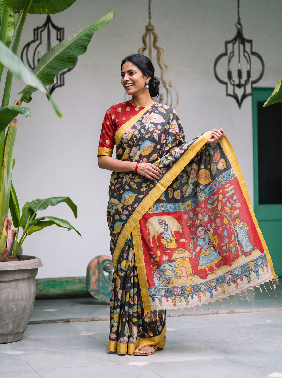 Red village scene pallu held out wide from the black Kalamkari saree, AI visual of the saree, iTokri