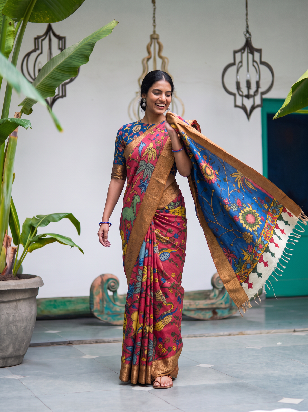 Royal blue sunflower pallu of the pink Kalamkari saree held out, with tassels, AI visual of the saree, iTokri