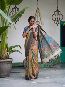 Teal figure pallu of the yellow Kalamkari saree held out, with cream tassels, AI visual of the saree, iTokri