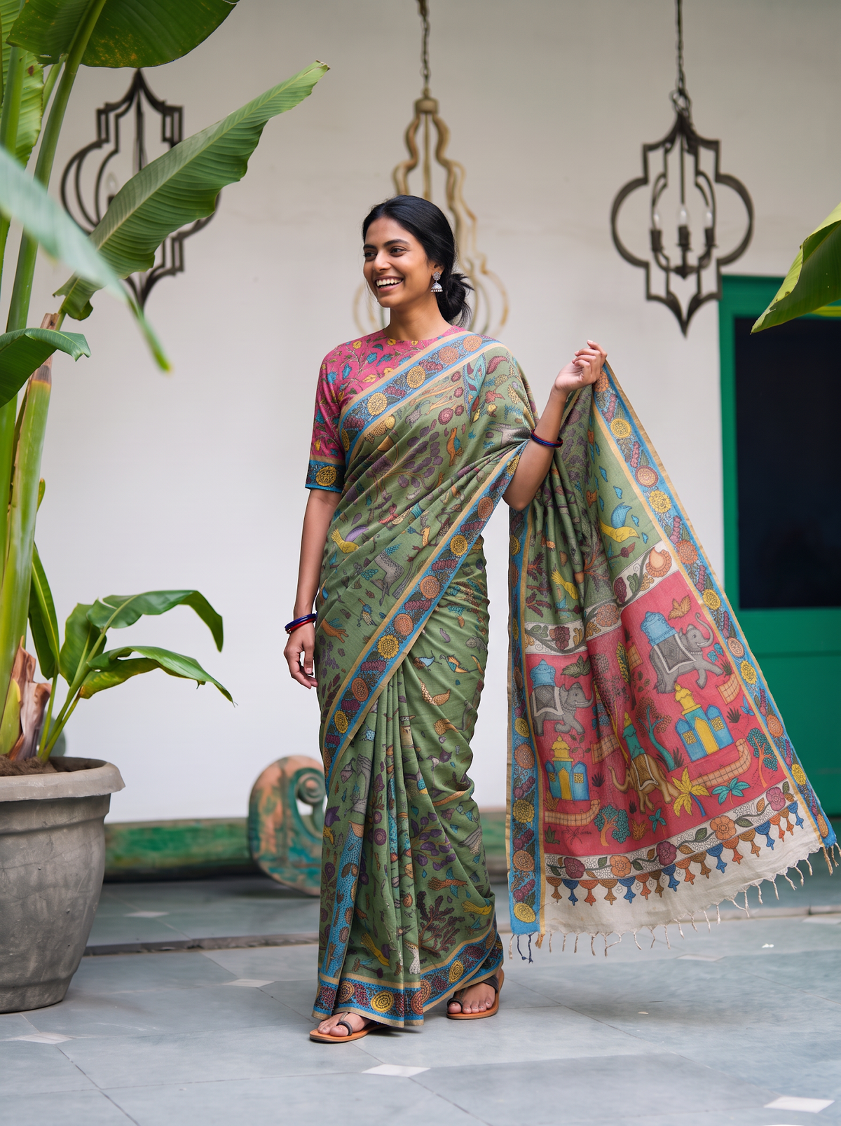 Coral elephant pavilion pallu held out wide from the sage green saree, AI visual of the saree, iTokri