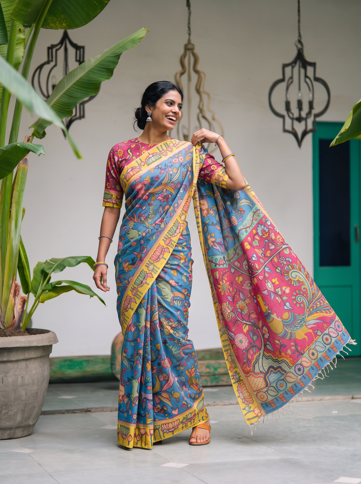 Magenta peacock pallu held out to the side from the blue lotus border saree, AI visual of the saree, iTokri