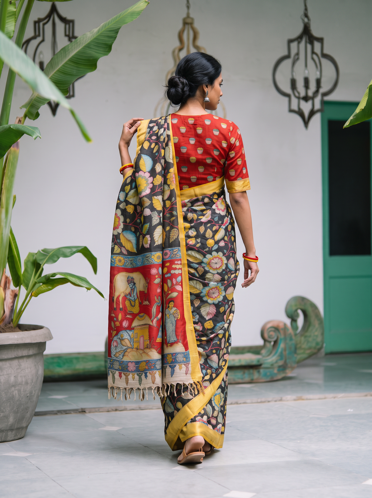Back view with the red village pallu falling over black flowers, AI visual of the saree, iTokri