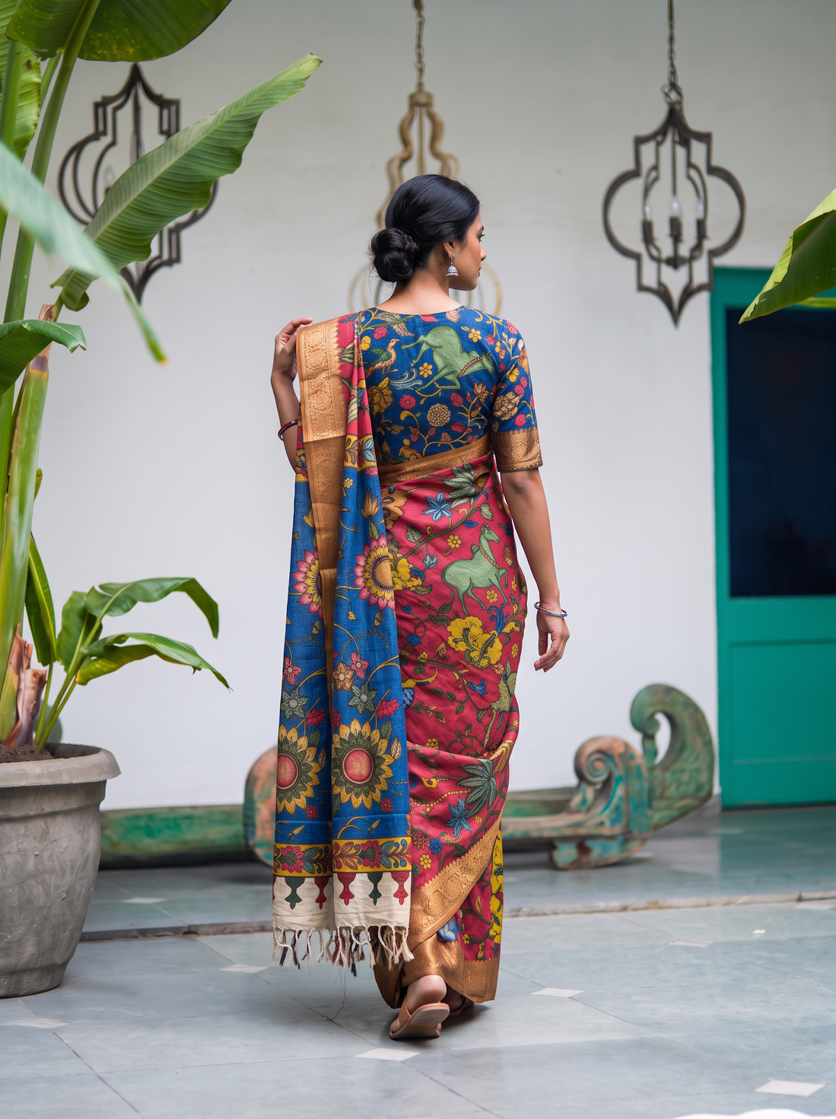 Back view of the pink pen Kalamkari saree with the blue pallu over the shoulder, AI visual of the saree, iTokri