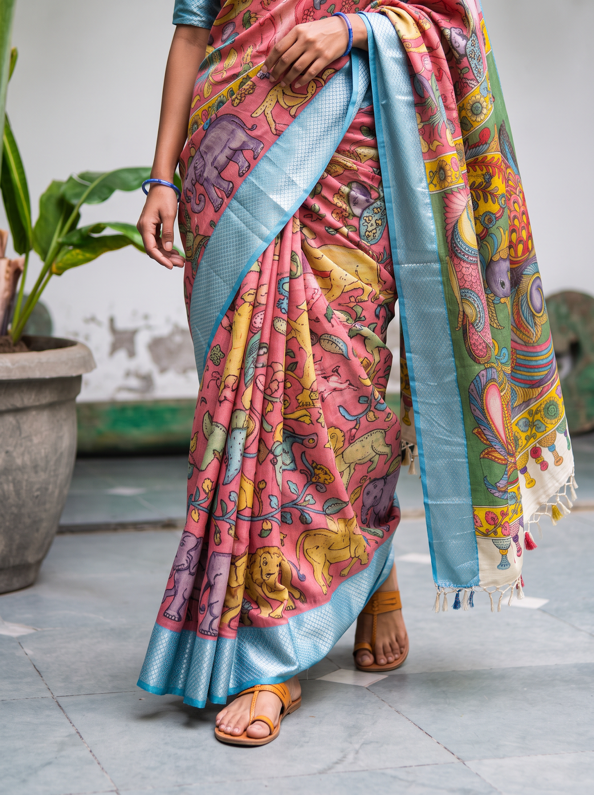 Pleats of the pink body with elephants and deer, hemmed in silvery sky blue, AI visual of the saree, iTokri