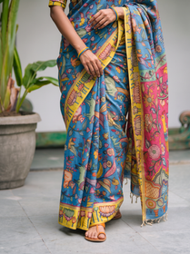 Pleats of the blue body above a yellow hem painted with lotuses, AI visual of the saree, iTokri