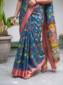 Pleats of the blue vine body above a shimmering pink hem, AI visual of the saree, iTokri