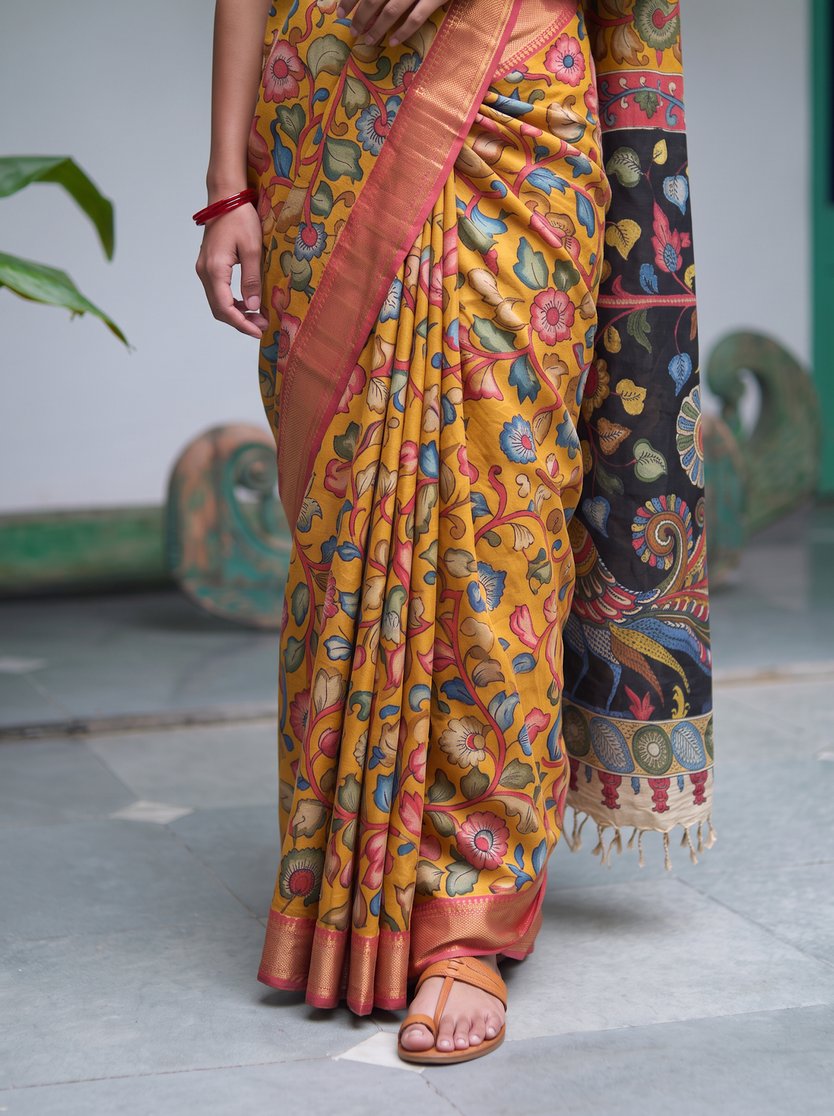 Pleats of the mustard silk cotton Kalamkari saree, coral gold border and pallu, AI visual of the saree, iTokri