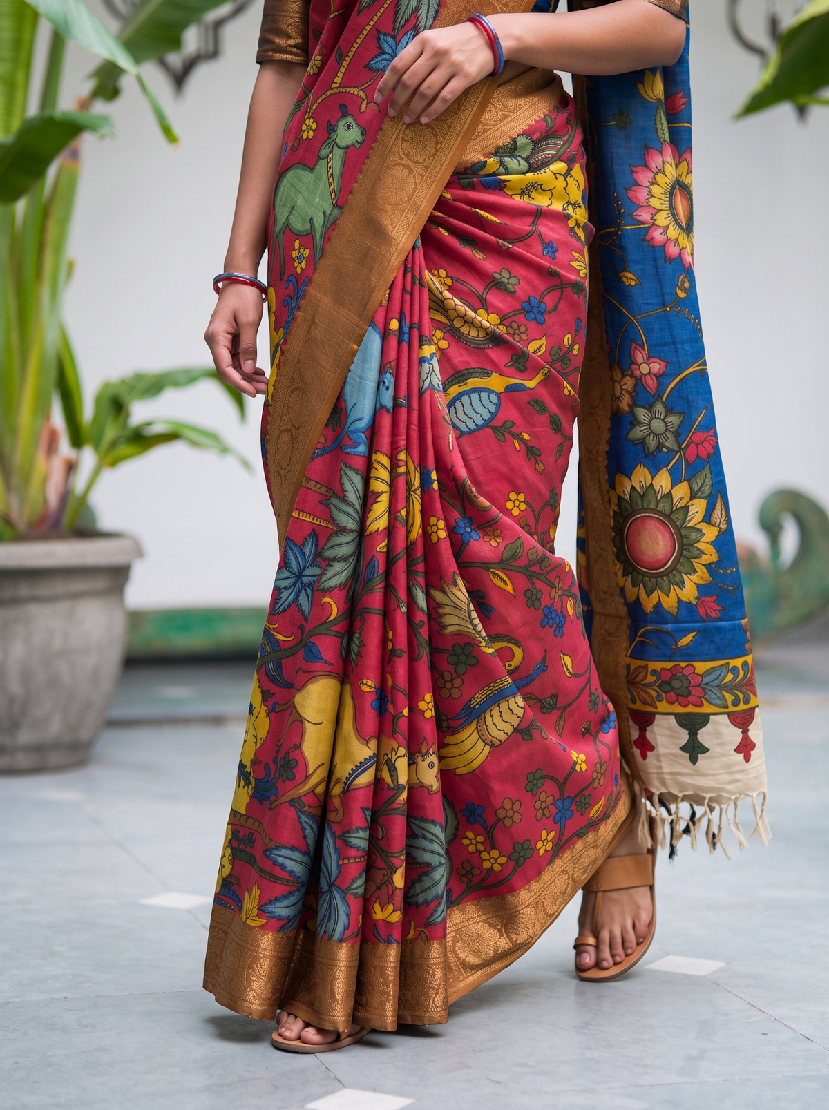 Pleats of the pink silk cotton saree showing deer, trees and the gold border, AI visual of the saree, iTokri