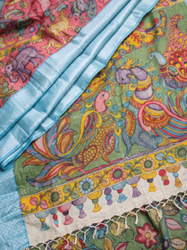 Detail of curling birds on the green pallu beside the silvery blue lattice border, AI visual of the saree, iTokri