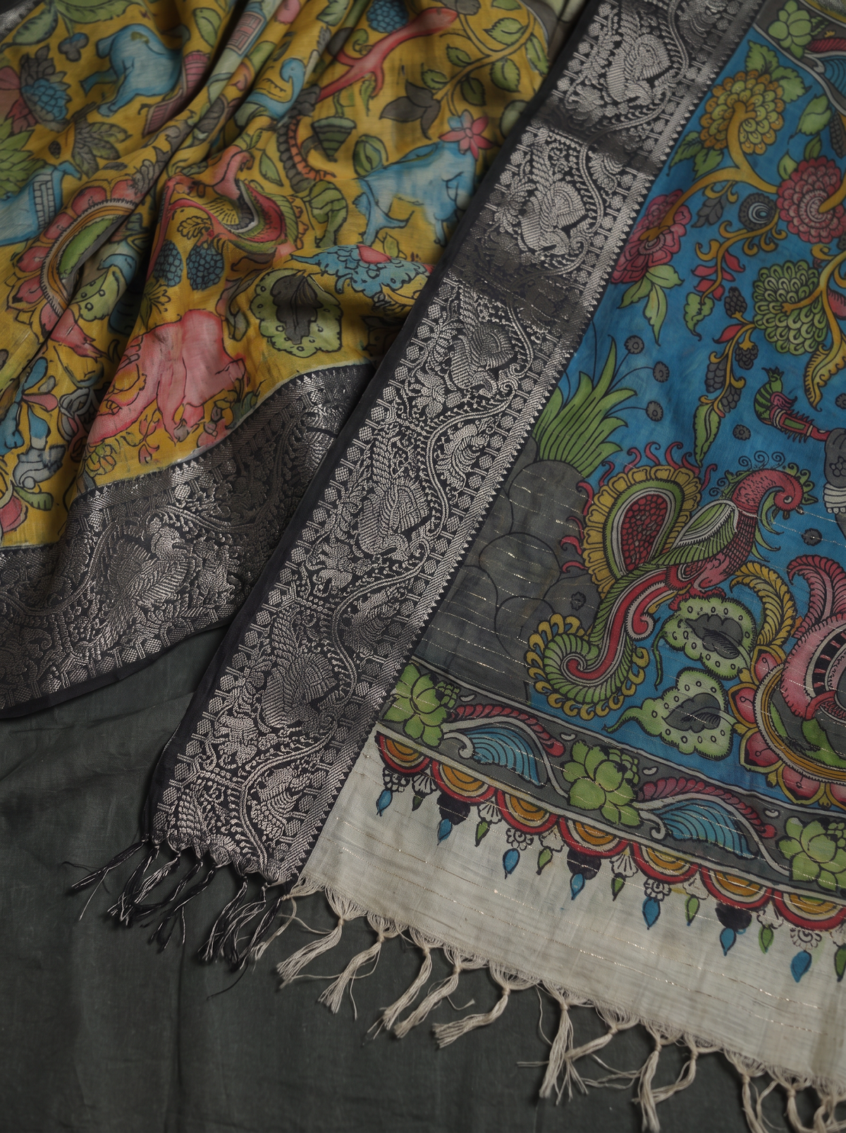 Teal pallu, black and silver woven border and tassels of the Kalamkari saree, detail, AI visual of the saree, iTokri