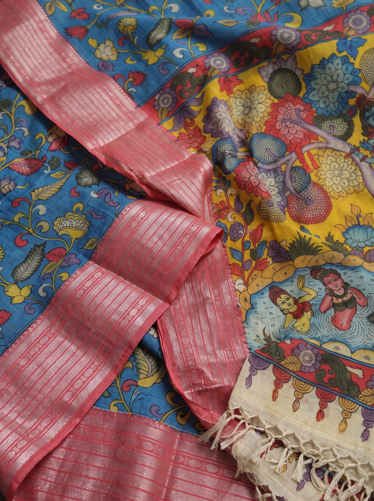 Detail of the pink striped border beside yellow blooms and figures by water, AI visual of the saree, iTokri