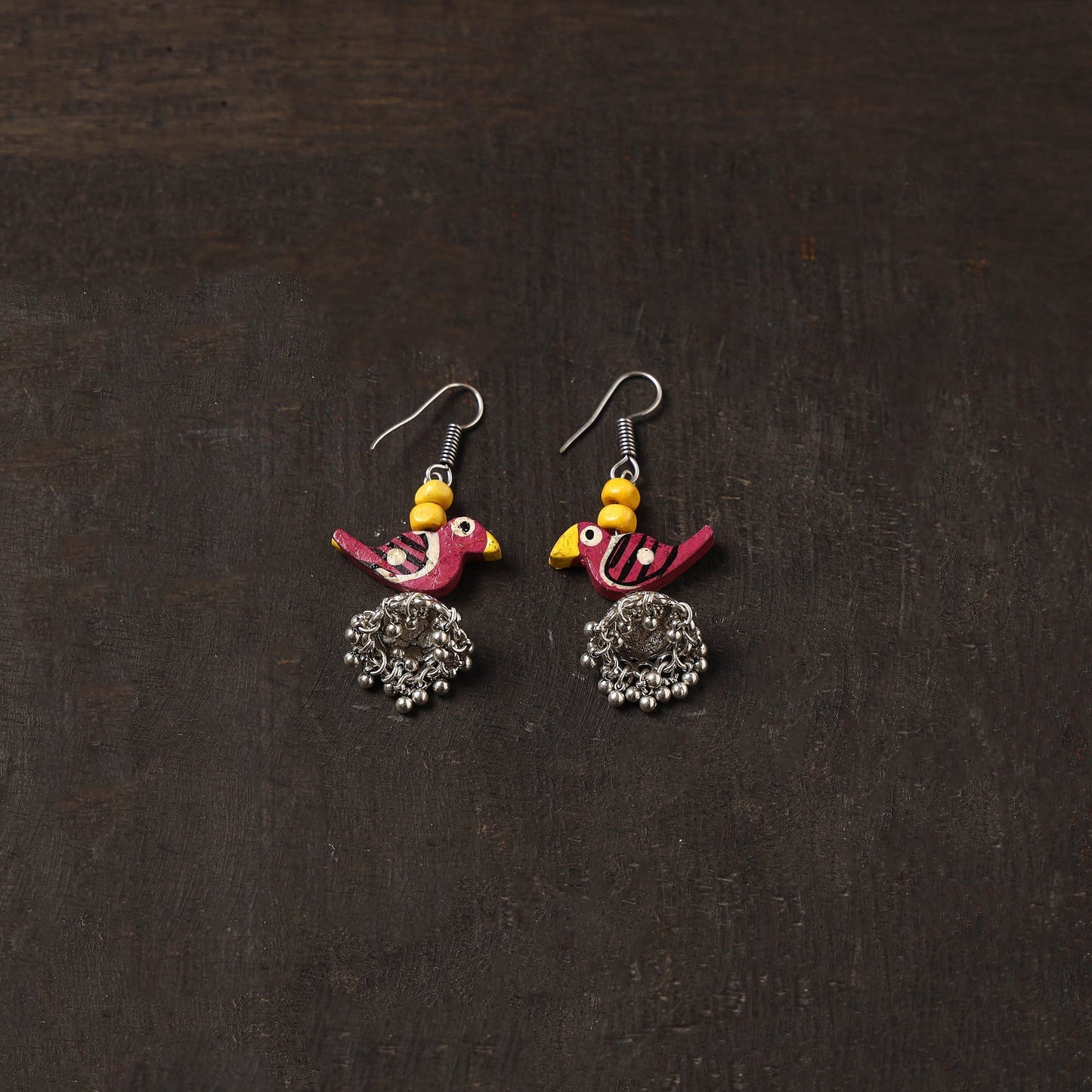 Noor german silver jhumki earrings with wooden bird