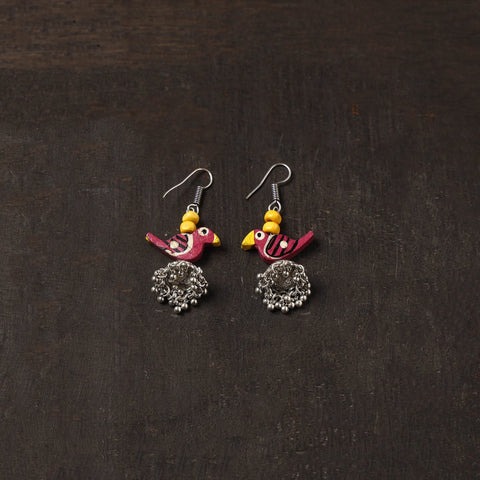 Noor german silver jhumki earrings with wooden bird