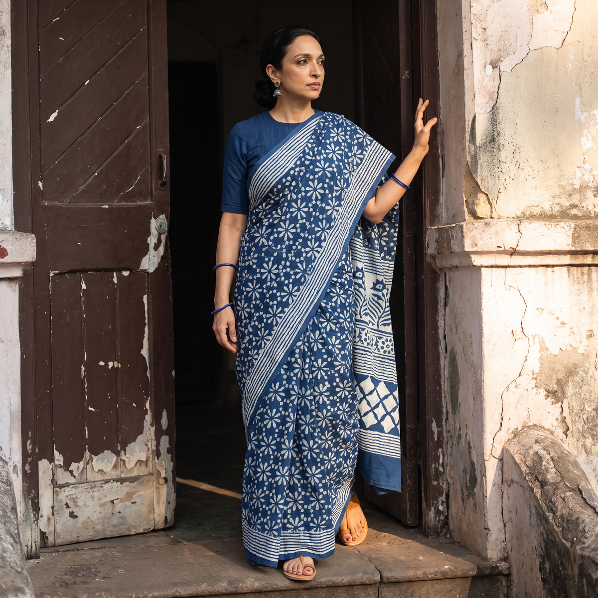 Blue Pipad Hand Block Printed Cotton Saree, draped and worn by a woman, AI visual of the saree, iTokri