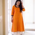 Orange Plain Art Silk Patterned Neck Band Kurta, worn by a woman for festive wear, also casual, daily wear, AI visual of the kurta, iTokri