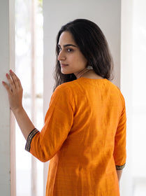 Orange Plain Art Silk Sequin Trim Kurta, over the shoulder view, bright orange slub art silk, plain, soft sheen, AI visual of the kurta, iTokri