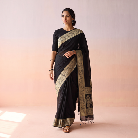Black Plain Banarasi Pure Handwoven Georgette Saree with Zari Border, draped and worn by a woman, AI visual of the saree, iTokri