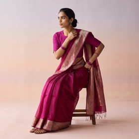 Pink Plain Banarasi Pure Handwoven Georgette Saree with Zari Border, draped and worn by a woman, AI visual of the saree, iTokri