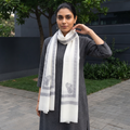 White Plain Fine Wool Stole with Woven Border, worn by a woman, AI visual of the stole, iTokri