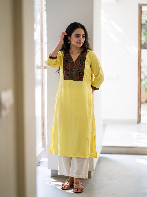 Yellow Plain Modal Silk Patchwork Yoke Kurta, worn by a woman for festive wear, also casual wear, AI visual of the kurta, iTokri