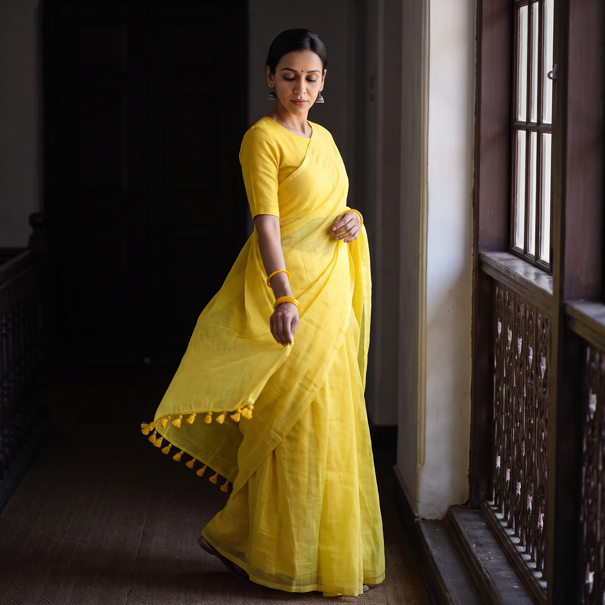 Yellow Plain Pure Mul Cotton Ready To Wear Saree, draped and worn by a woman, AI visual of the saree, iTokri