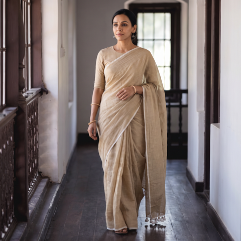 Beige Plain Pure Mul Cotton Ready To Wear Saree, draped and worn by a woman, AI visual of the saree, iTokri