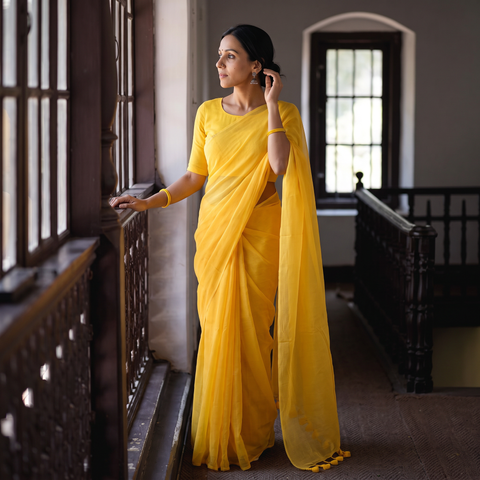 Yellow Plain Pure Mul Cotton Ready To Wear Saree, draped and worn by a woman, AI visual of the saree, iTokri