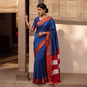 Blue Plain Silk Cotton Zari Border Saree with Blouse Piece, draped and worn by a woman, AI visual of the saree, iTokri