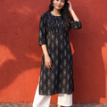 Black Pochampally Ikat Cotton Pintuck Yoke Kurta, worn by a woman for office wear, also daily wear, AI visual of the kurta, iTokri