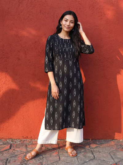 Black Pochampally Ikat Cotton Pintuck Yoke Kurta, worn by a woman for office wear, also daily wear, AI visual of the kurta, iTokri