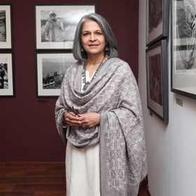 Grey Pochampally Ikat Pure Handwoven Merino Wool x Silk Shawl, worn by a model, AI visual of the shawl, iTokri