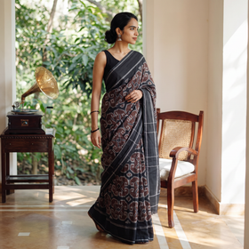 Brown Pochampally Ikat Weave Handloom Cotton Saree, draped and worn by a woman, AI visual of the saree, iTokri