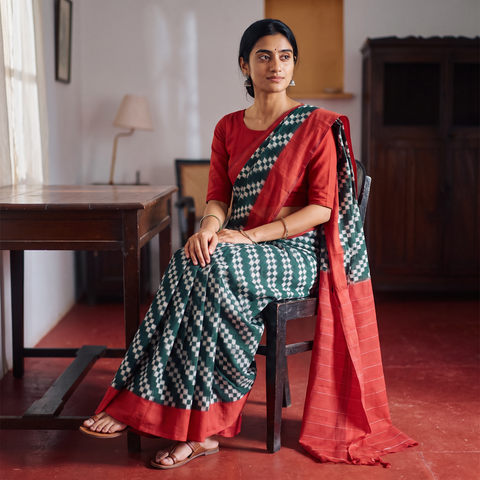 Green Pochampally Ikat Weave Handloom Cotton Saree, draped and worn by a woman, AI visual of the saree, iTokri