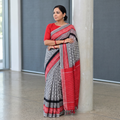 Grey Pochampally Ikat Weave Handloom Cotton Saree, draped and worn by a woman, AI visual of the saree, iTokri