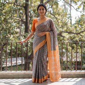 Grey Pochampally Ikat Weave Mercerised Cotton Saree, draped and worn by a woman, AI visual of the saree, iTokri